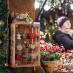 a woman standing in front of a christmas display