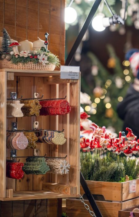 a woman standing in front of a christmas display