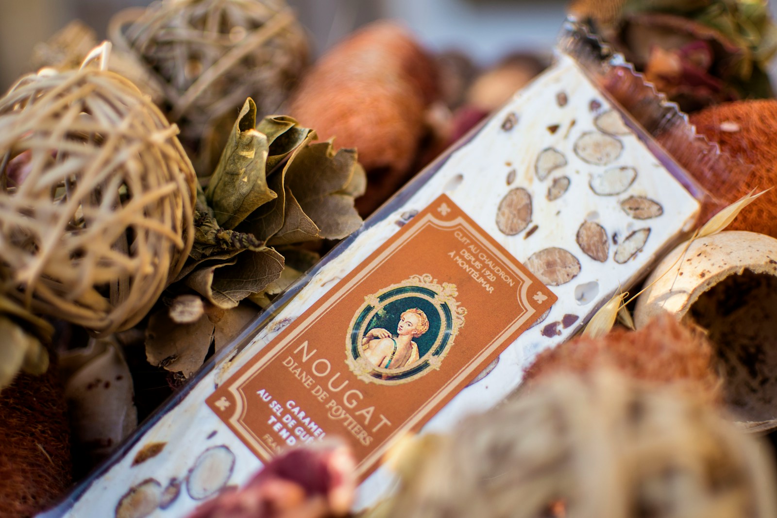 Nougat candy bar nestled among decorations.