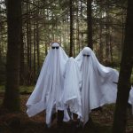 a group of white dresses in a forest