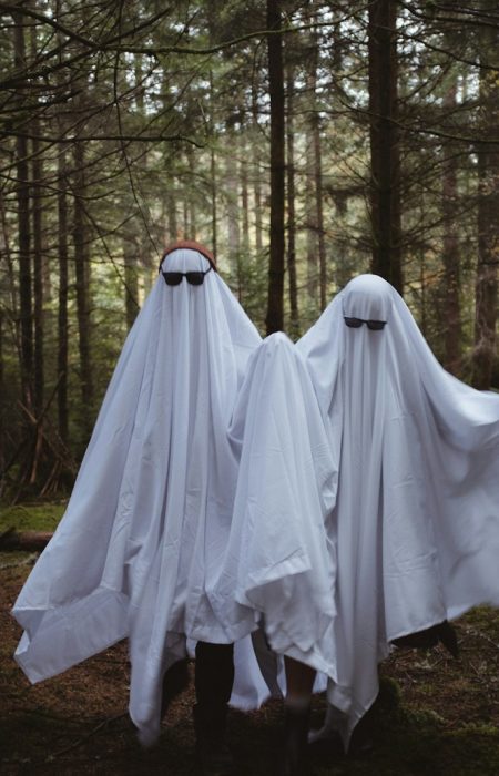 a group of white dresses in a forest