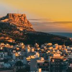 a view of a city with a mountain in the background