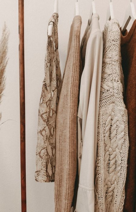 hanged top on brown and white clothes horse