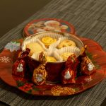 red and white ceramic cup on red and white ceramic round plate