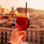 a person holding a wine glass