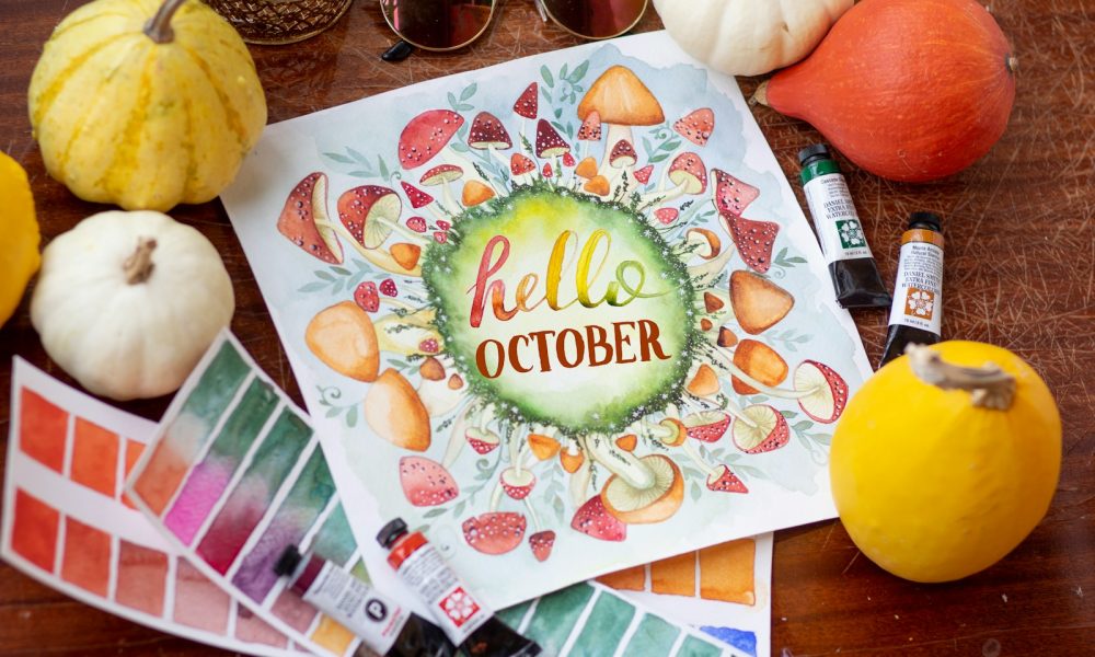 yellow round fruit on white and red floral table cloth