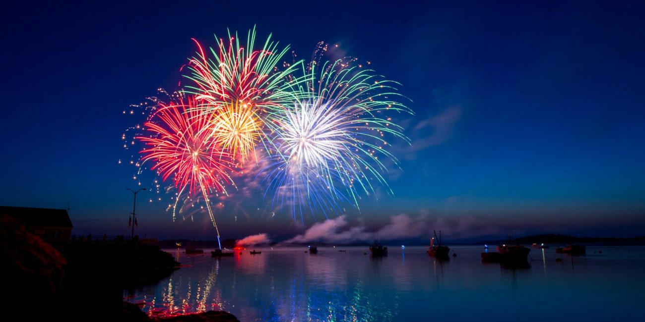 The Local Fiesta: Rojales – Day of the Virgen del Rosario green, red, and white fireworks on sky at nighttime