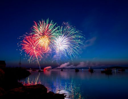 green, red, and white fireworks on sky at nighttime