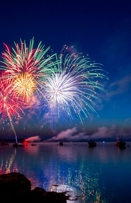 green, red, and white fireworks on sky at nighttime