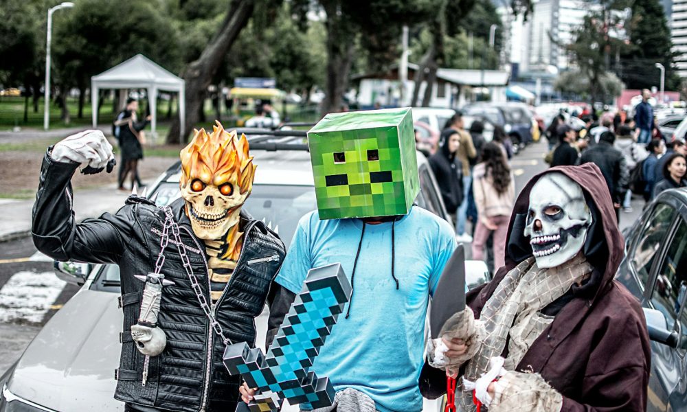 Grand Halloween Parade A group of people in costume standing next to each other