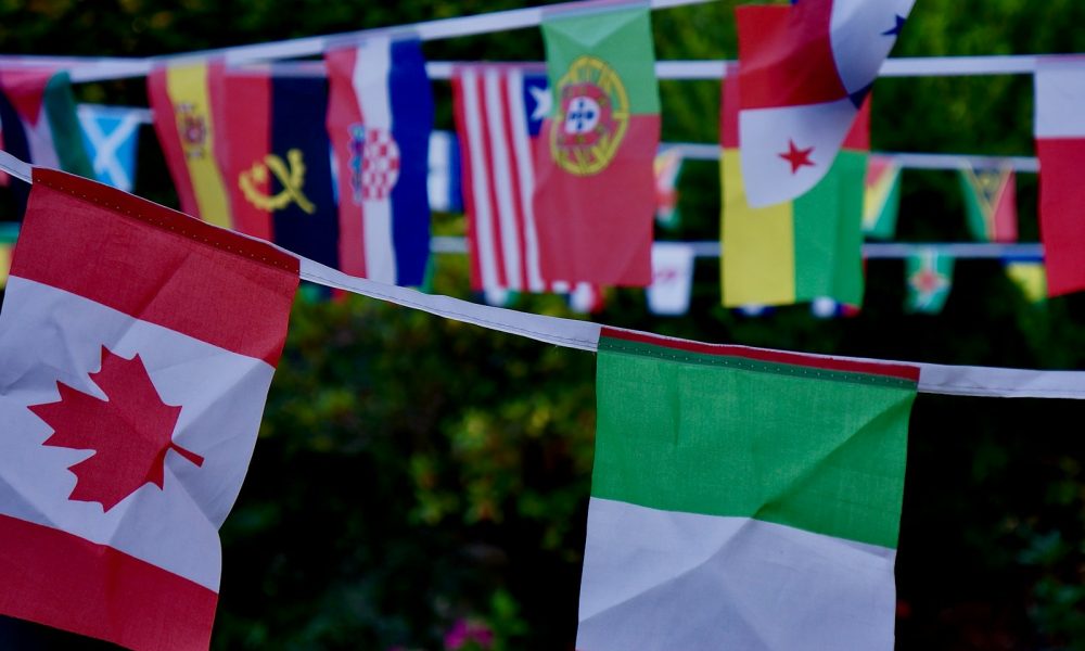 The World Comes to Alfaz del Pi: Your Invitation to a Global Fiesta! green white and red flag
