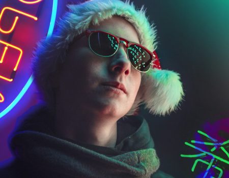 man in black aviator sunglasses and purple hoodie