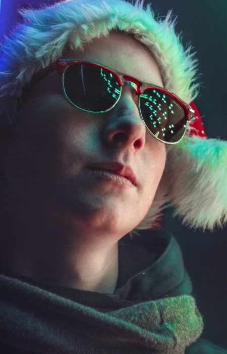 man in black aviator sunglasses and purple hoodie