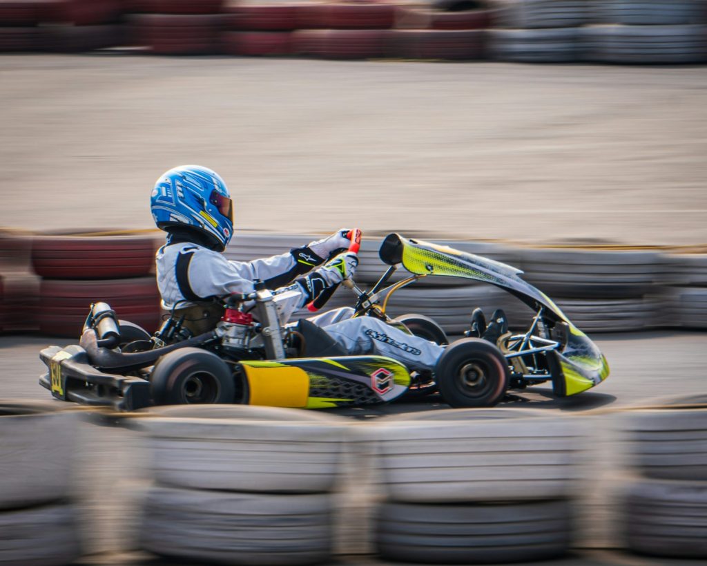 a person riding a go kart on a track