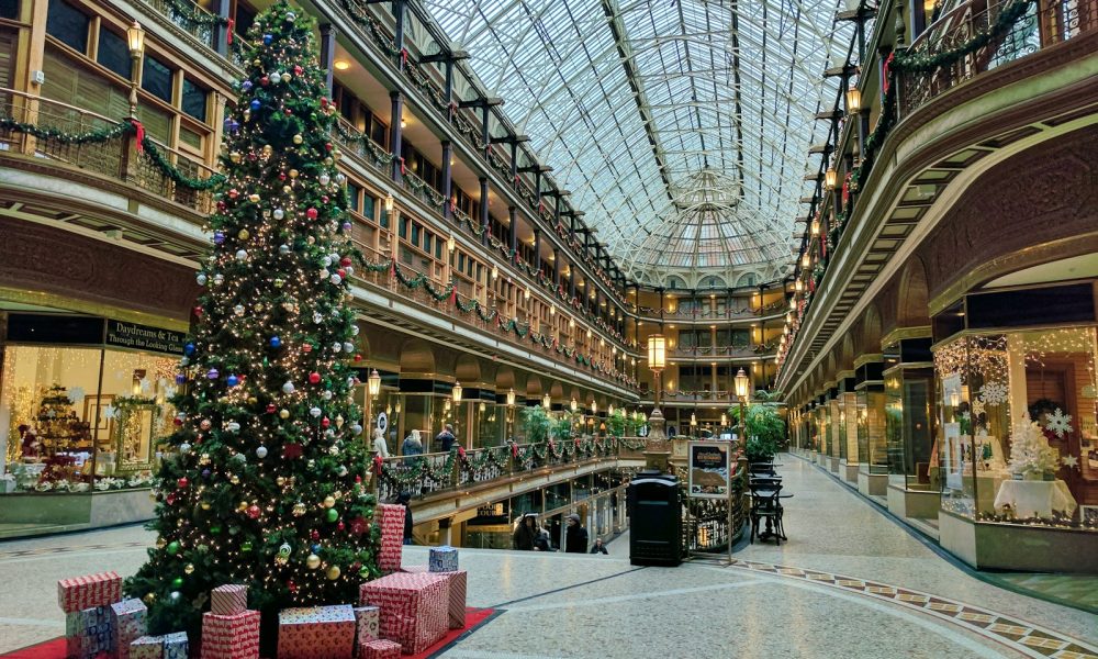 state of the art building interior with lit Christmas tree