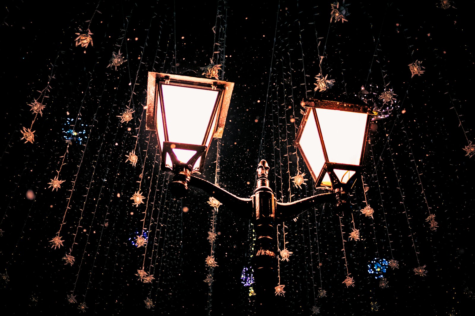 Opening of Christmas in Guardamar A couple of lights that are on a pole