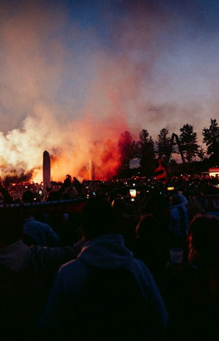 A large crowd of people watching a concert